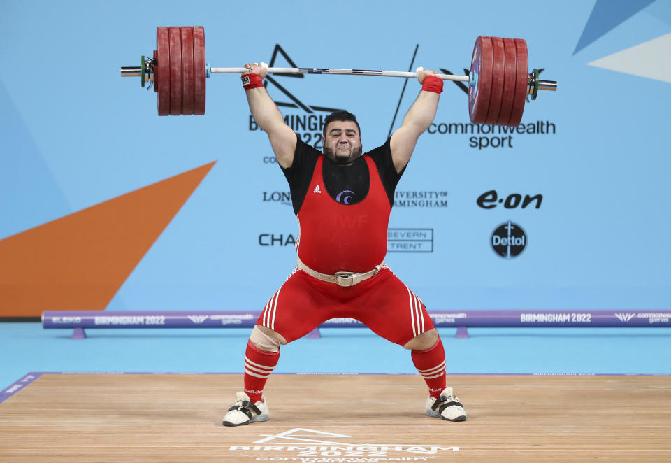 Pakistan's Muhammad Noon Dastgir Butt lifts, during the Men's 109kg+ Final at The NEC on day six of the 2022 Commonwealth Games in Birmingham, England, Wednesday, Aug. 3, 2022. (Isaac Parkin/PA via AP)