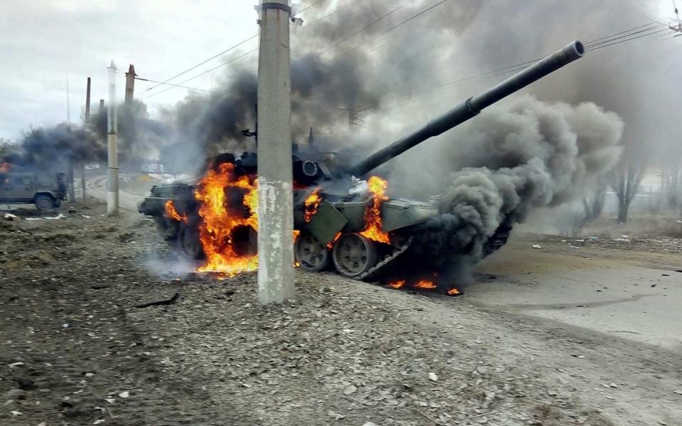 A tank burns in the Ukrainian city of Sumy just days after newly revealed dashcam footage showed a huge column of tanks moving into the city, February 27 2022.  - SWNS