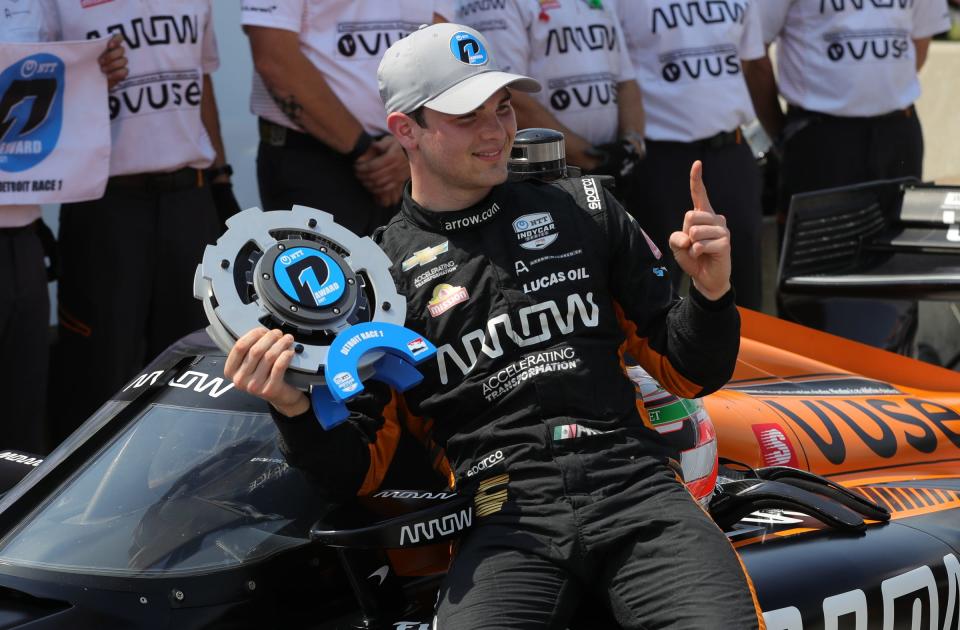 Pato O'Ward celebrates after winning the pole for Saturday's Detroit Grand Prix Dual I at Belle Isle.