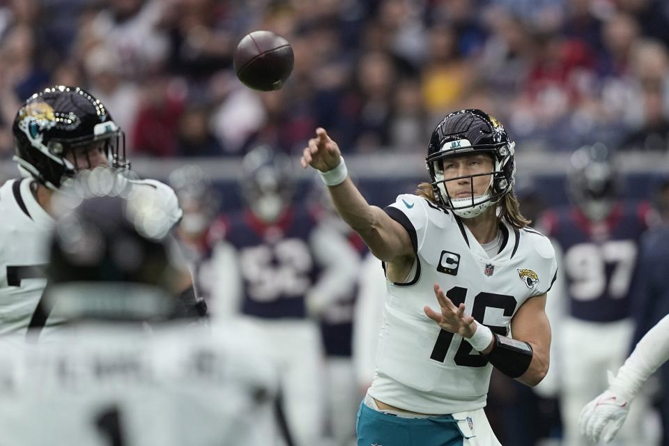 Jacksonville Jaguars quarterback Trevor Lawrence (16) throws against the Houston Texans during the first half of an NFL football game in Houston, Sunday, Jan. 1, 2023. (AP Photo/David J. Phillip)