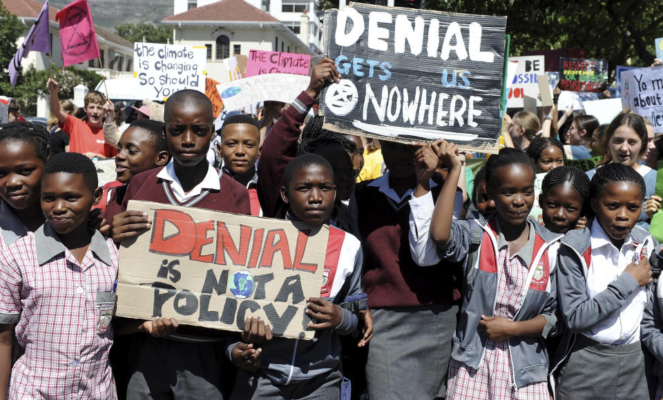 Students in Cape Town, South Africa take part in a protest, Friday, March 15, 2019 as part of a global student strike against government inaction on climate change. Students in cities worldwide skipped classes to protest their governments' failure to act against global warming. (AP Photo/Nasief Manie)