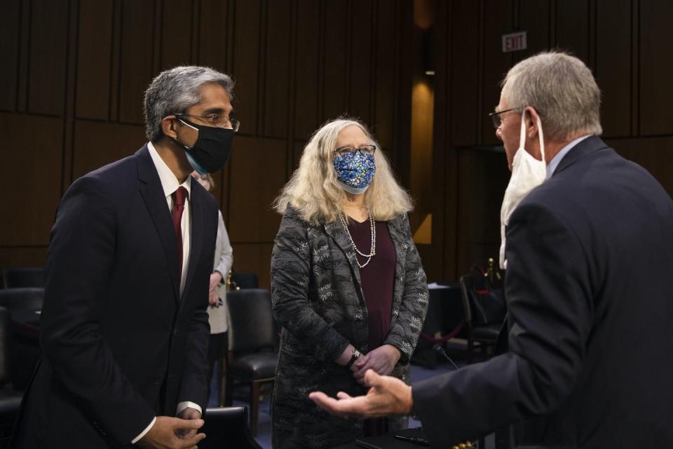 The officials in a congressional hearing room