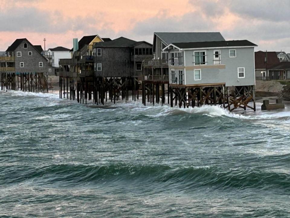 The town of Rodanthe faces aggressive beach erosion that has already taken multiple houses. These few, seen from the pier, sit a few houses down from Hilary Graf’s house, where she wards off the waves with the sound of a shofar and roaring lion.