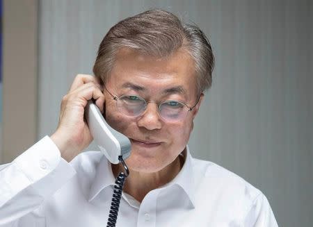 South Korean President Moon Jae-in speaks with U.S. President Donald Trump by telephone at his house in Seoul, South Korea in this handout picture provided by the Presidential Blue House and released by Yonhap on May 10, 2017. Blue House/Yonhap via REUTERS