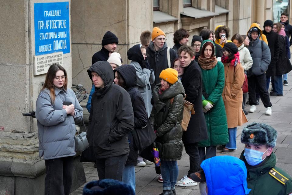 Voters line up at a polling station in St. Petersburg, Russia, at noon local time on Sunday, March 17, 2024. The Russian opposition called on people to head to polling stations at noon on Sunday in protest during votin on the last day of a presidential election.