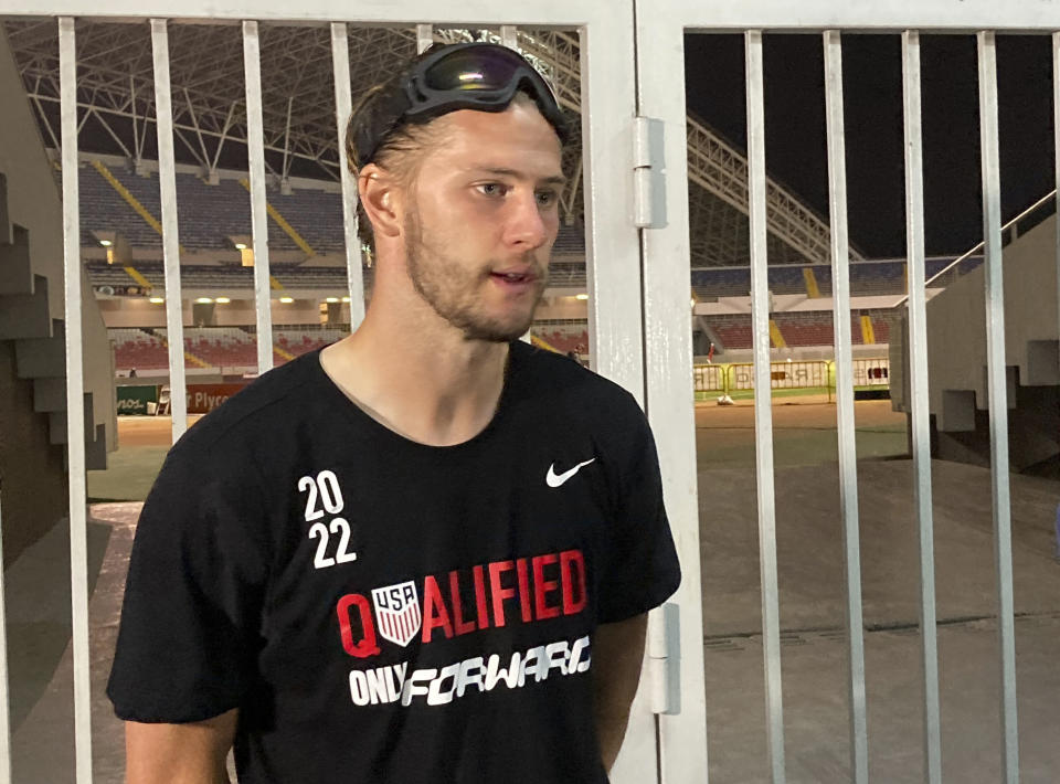 U.S. defender Walker ZImmerman talks to reporters after U.S. clinched a 2022 World Cup soccer berth, despite a 2-0 loss to Costa Rica in San Jose, Costa Rica on the final night of qualifying Wednesday, March 30, 2022. (AP Photo/Ron Blum)