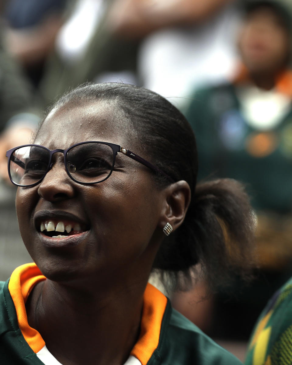 A South African fan celebrates at Vilakazi street in Soweto, South Africa, after their team's victory in the Rugby World Cup final between South Africa and England being played in Tokyo, Japan from Saturday Nov. 2, 2019. South Africa defeated England 32-12. (AP Photo/Themba Hadebe)