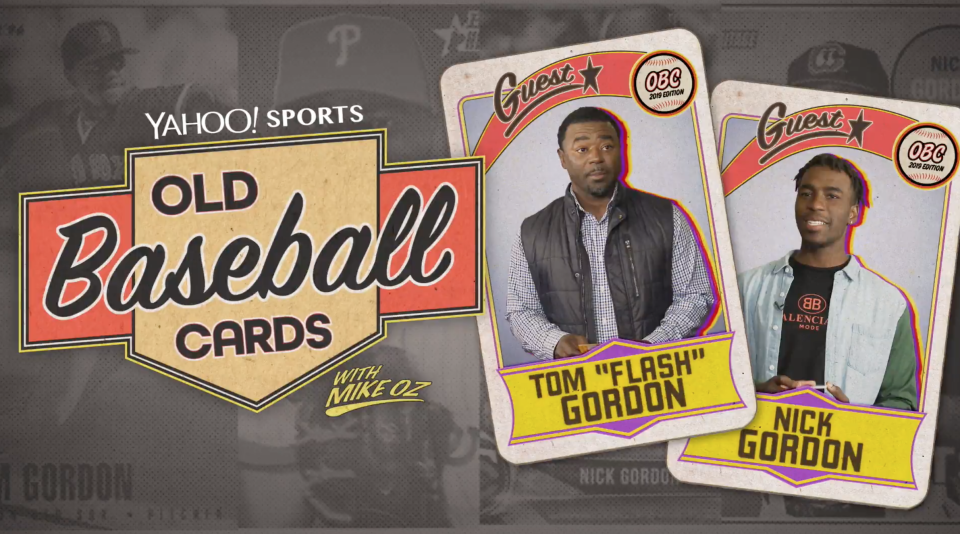Ex-MLB pitcher Tom Gordon and his son, Twins prospect Nick Gordon, open backs of baseball cards. (Yahoo Sports)