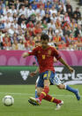 Spanish midfielder Cesc Fabregas scores during the Euro 2012 championships football match Spain vs Italy on June 10, 2012 at the Gdansk Arena. AFP PHOTO / PIERRE-PHILIPPE MARCOUPIERRE-PHILIPPE MARCOU/AFP/GettyImages