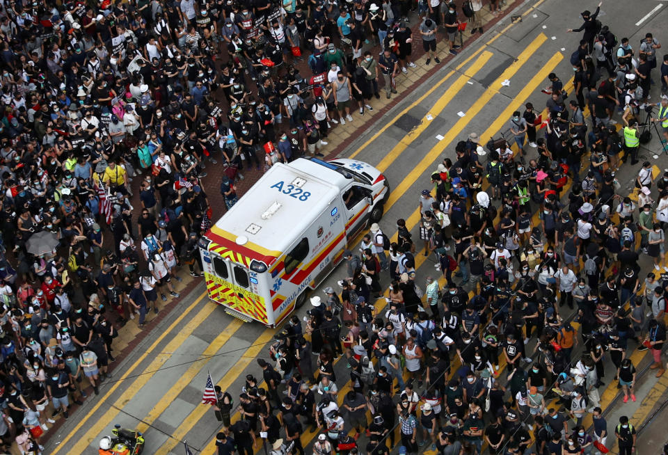 Anti-government protesters make way for an ambulance to pass as they attend a demonstration at Causeway Bay in Hong Kong, China, September 15, 2019. REUTERS/Athit Perawongmetha