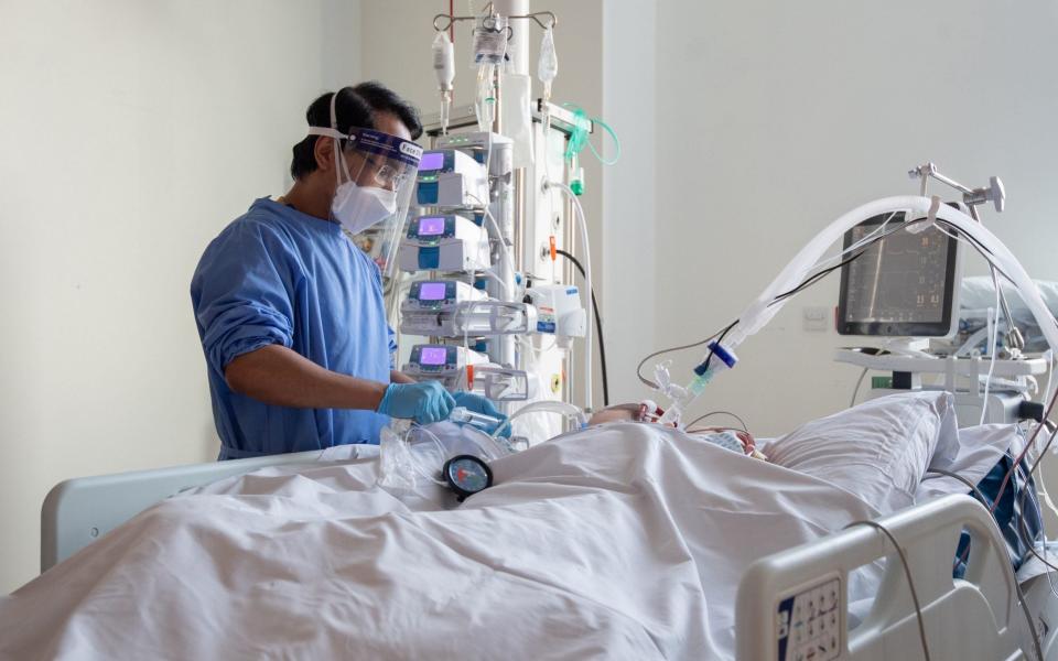 File photo dated 19/03/21 of a nurse checking on a patient suffering with Covid-19 on the critical care unit. People who get the most ill from Covid-19 could be offered a new lifeline with the first antiviral drug shown to save lives in patients admitted to hospital, researchers have said - PA