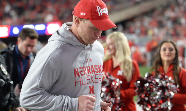 Nebraska football head coach Scott Frost runs off the field after a loss to Ohio State.