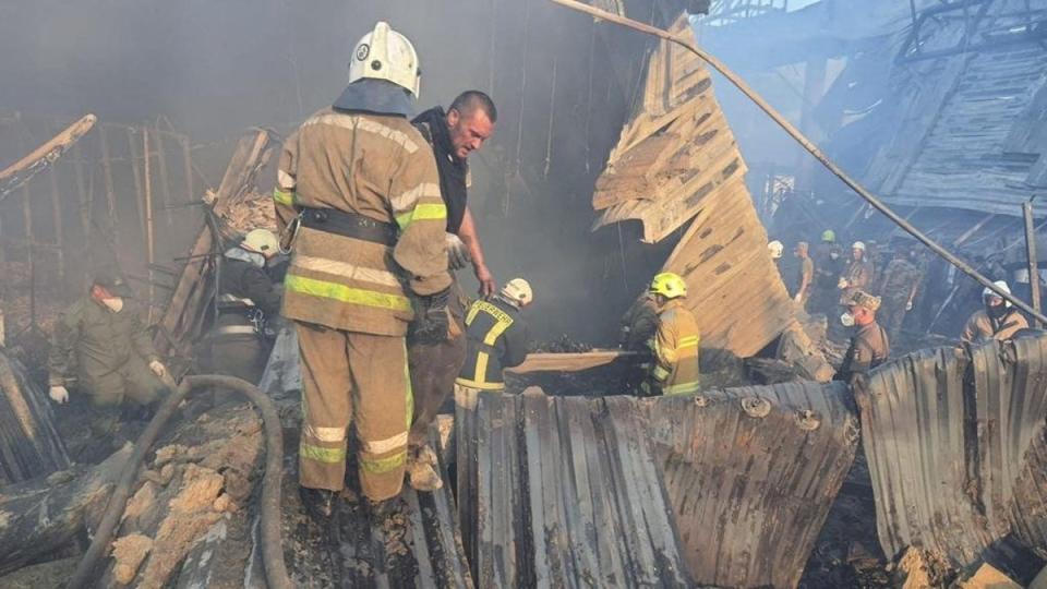 Rescuers at the site of a shopping mall hit (Via REUTERS)