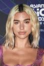 <p> Lipa&apos;s two-toned bob made waves&#x2013;literally. With an intense center part and shoulder-scraping lengths, Dua&apos;s look is enviable. This look can be mimicked with a curling wand and some texture spray. </p>