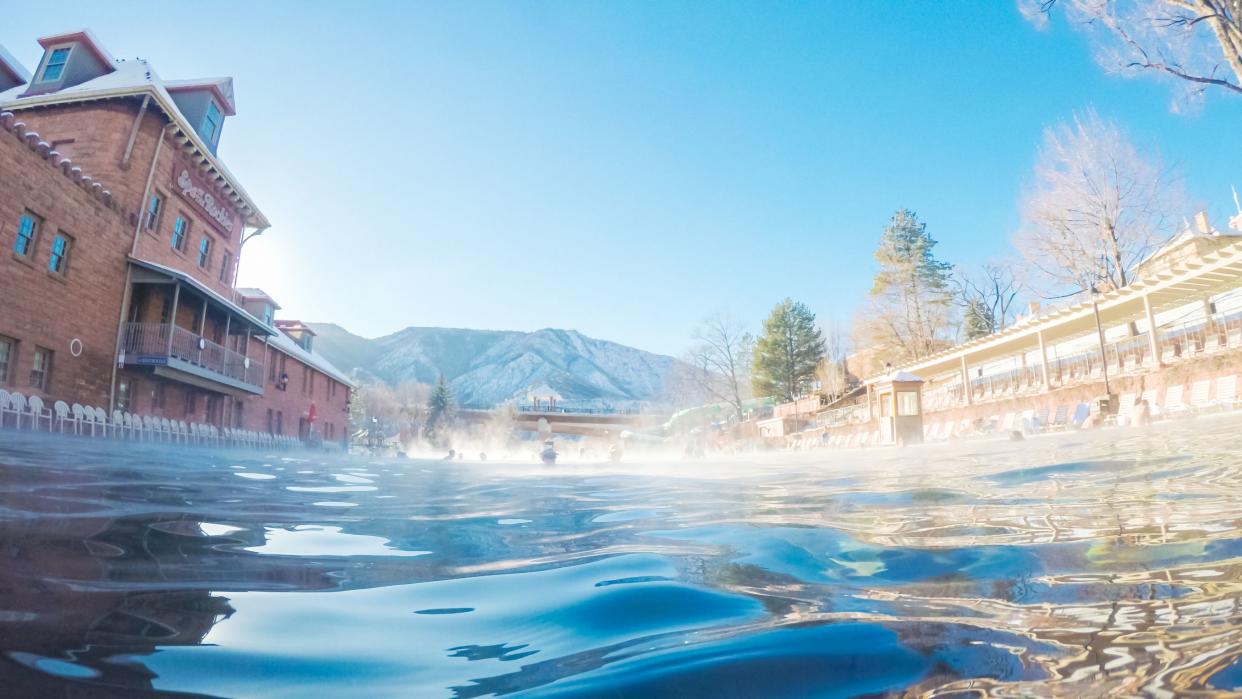 Swimming in outdoor hot springs pool in the Winter.