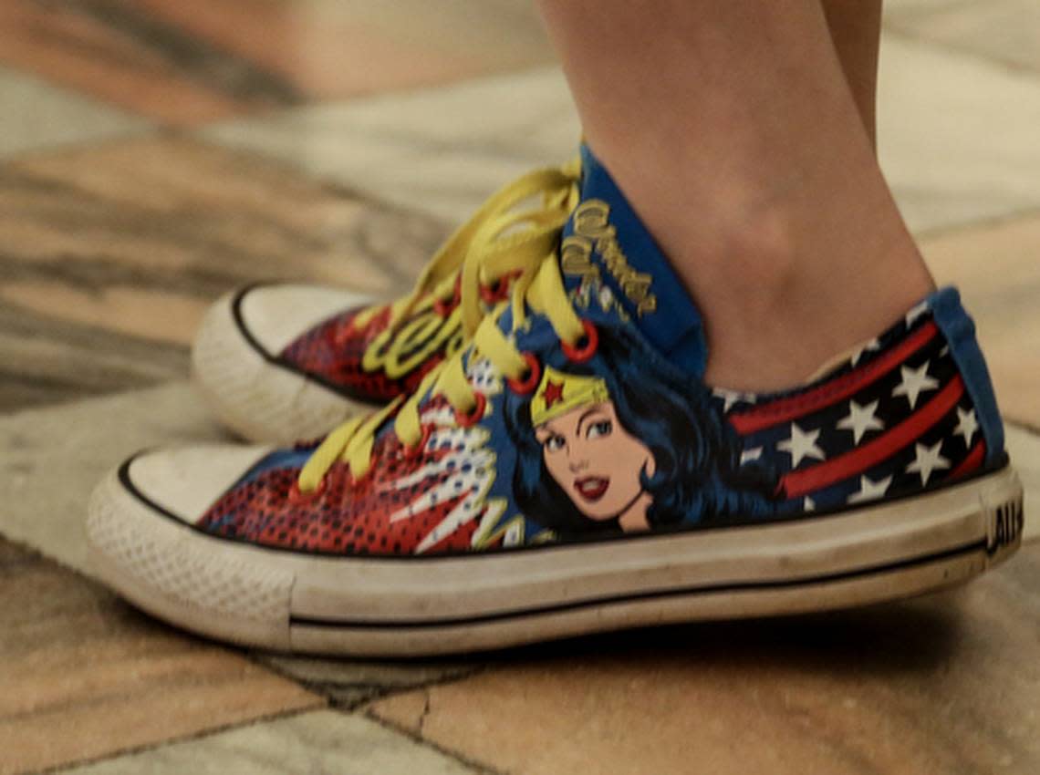 USC men’s basketball Coach Frank Martin helped the American Cancer Society Cancer network kick off Suits & Sneakers event at the statehouse. As a way or raising awareness to cancer, many legislators wore sneakers to session. Here, Sen. Katrina Shealy wore her Wonder Woman sneakers. 4/15/15