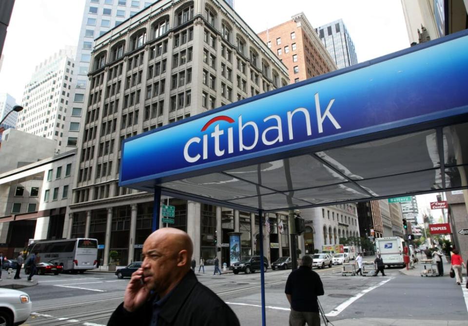 SAN FRANCISCO – APRIL 18: Pedestrians walk by a Citibank office April 18, 2008 in San Francisco, California. Citigroup has reported a $5.1 billion first quarter loss and plans to cut 9,000 jobs as the bank continues to struggle with home and car loan losses. (Photo by Justin Sullivan/Getty Images)