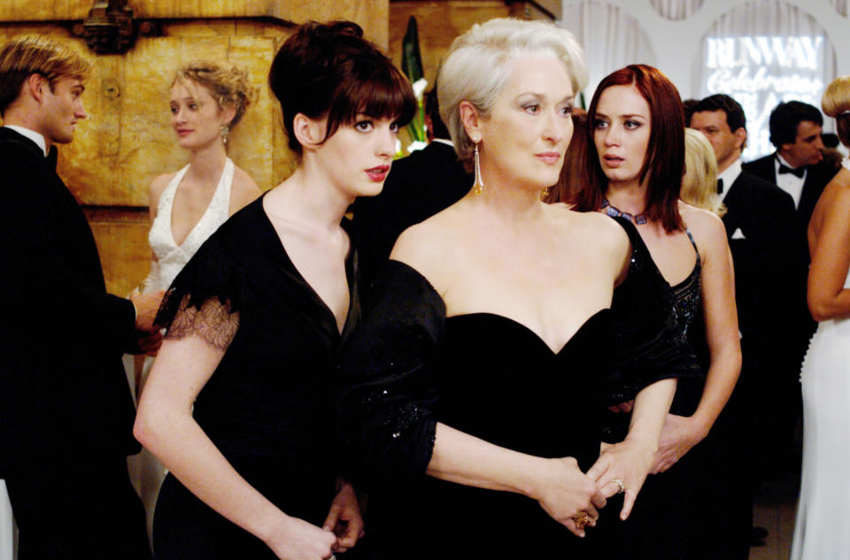 Anne Hathaway and Emily Blunt on each side of Meryl Streep in 'The Devil Wears Prada'