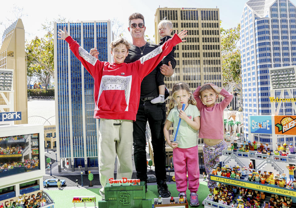 <p>Robin Thicke has a ball with his kids while on a visiting Legoland in California on March 25. </p>