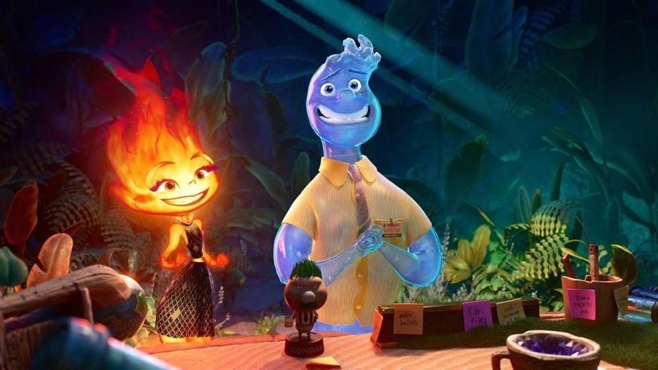 a flame and a water droplet share a moment in a scene from elemental, a good housekeeping pick for best kids movies 2023