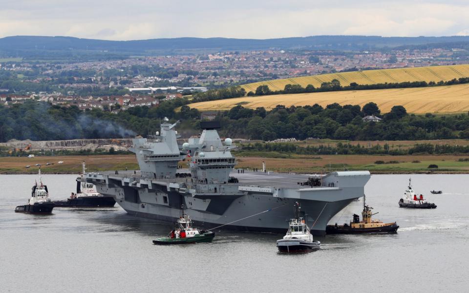 HMS Queen Elizabeth starting to exit the Rosyth dock - Credit: BEN SHREAD/MoD