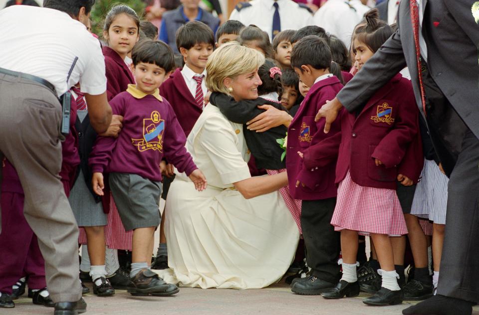Princess Diana embraces a school pupil in Neasden in 1997 (Photo by Tim Graham/Getty Images)