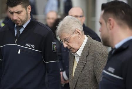 Reinhold H., a 94-year-old former guard at Auschwitz is escorted after the first day of his trial in Detmold, Germany, February 11, 2016. REUTERS/Bernd Thissen/Pool