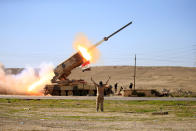 <p>Members of the Iraqi army launch a rocket towards Islamic State militants during a battle with the IS in western Mosul, Iraq February 25, 2017. (Alaa Al-Marjani/Reuters) </p>