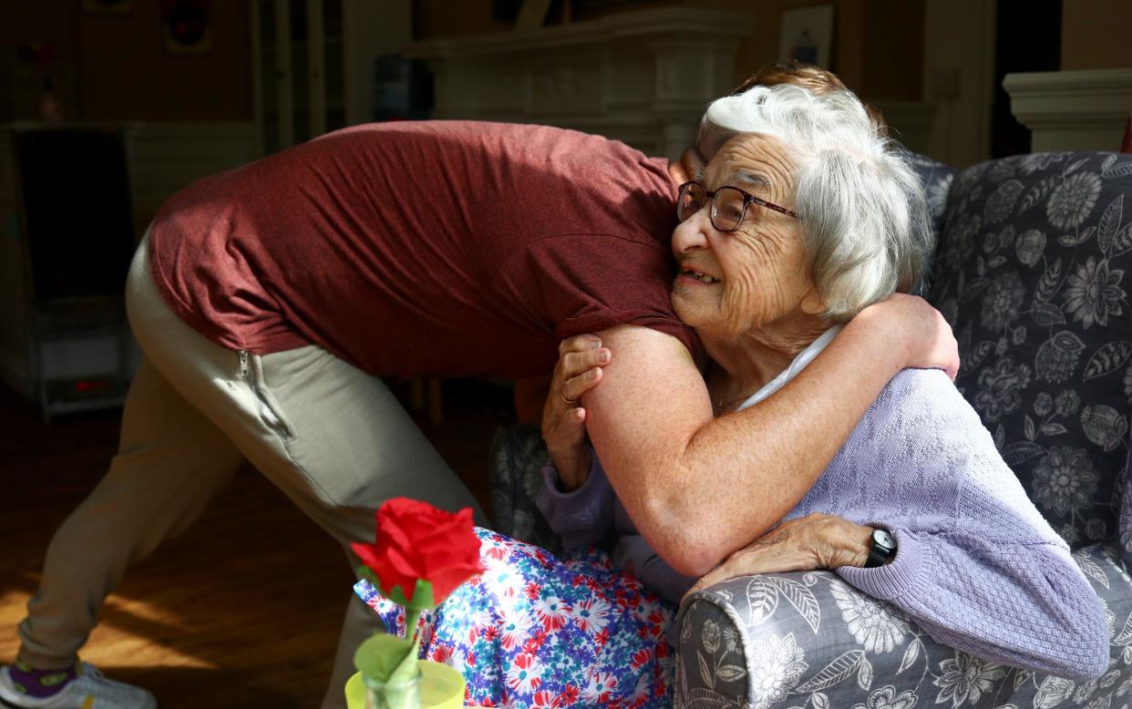 The Government has also strengthened the role of the 'essential care giver', meaning every resident should be able to nominate a friend or family member to provide extra care on their visits - Hannah McKay/Reuters