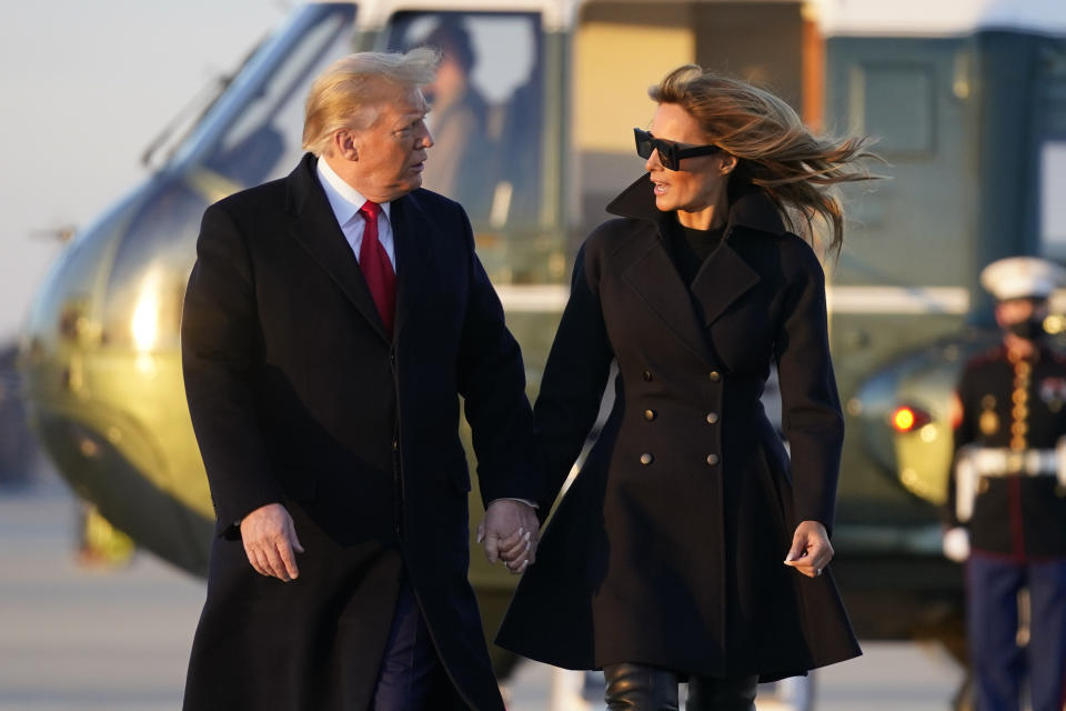 President Donald Trump and first lady Melania Trump walk to board Air Force One at Andrews Air Force Base, Md., Wednesday, Dec. 23, 2020. Trump is traveling to his Mar-a-Lago resort in Palm Beach, Fla. (AP Photo/Patrick Semansky)