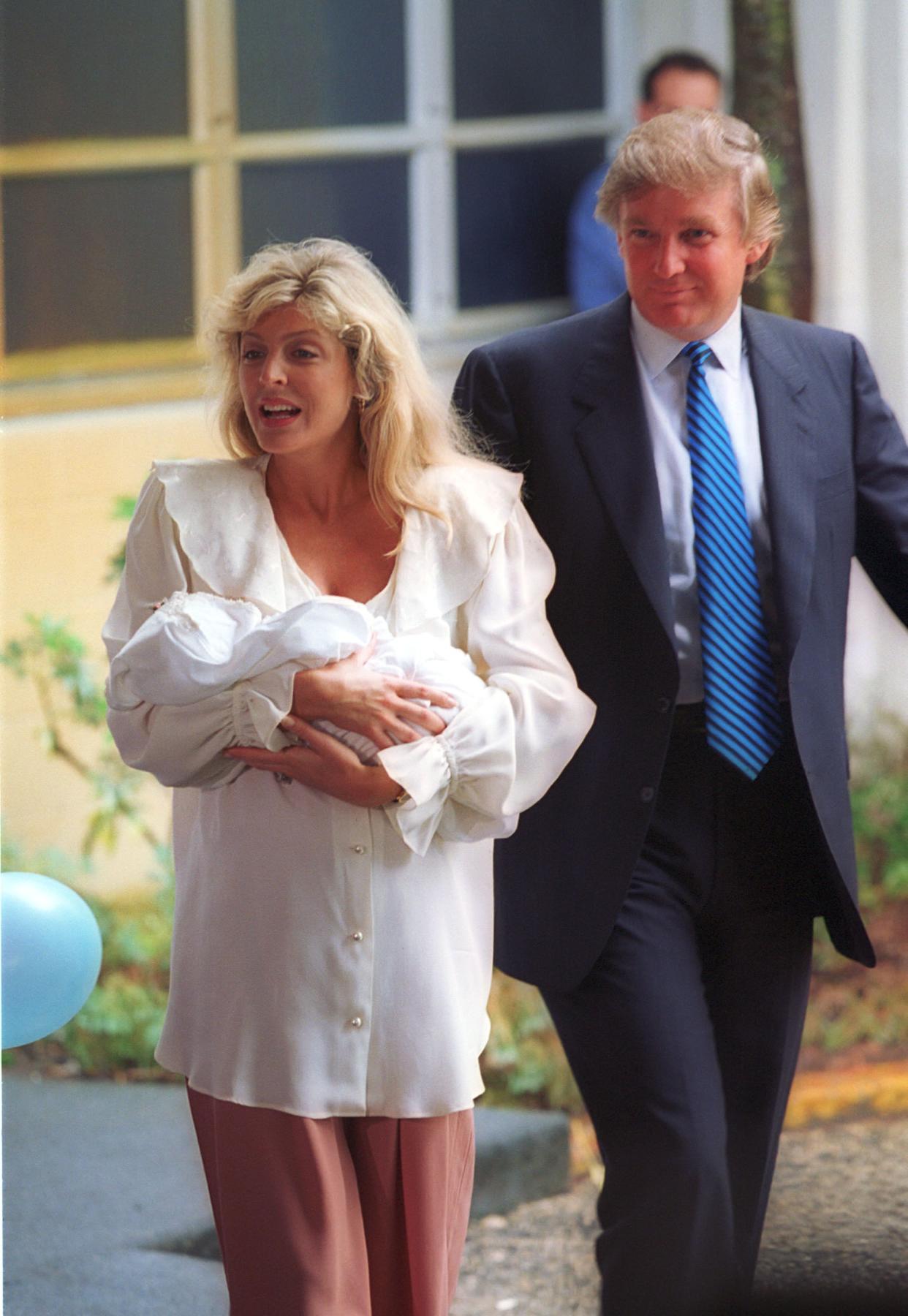 Proud parents Marla Maples and Donald Trump leave St. Mary's Hospital in West Palm Beach, Fla., with their newborn baby girl, Tiffany, on Oct. 14, 1993 weighing 7 lbs., 7 1/2 oz.