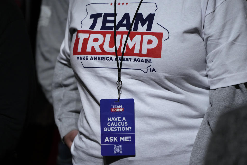 FILE - An audience member waits for former President Donald Trump to arrive at a commit to caucus rally, Sunday, Oct. 29, 2023, in Sioux City, Iowa. Trump is pushing his supporters to deliver a blowout win in the Iowa caucuses one month away. Unlike his first time in the caucuses, Trump’s campaign is now run by Iowa veterans who are not just locking in caucus commitments but building a formidable organization to try to lock in his lead. (AP Photo/Charlie Neibergall, File)