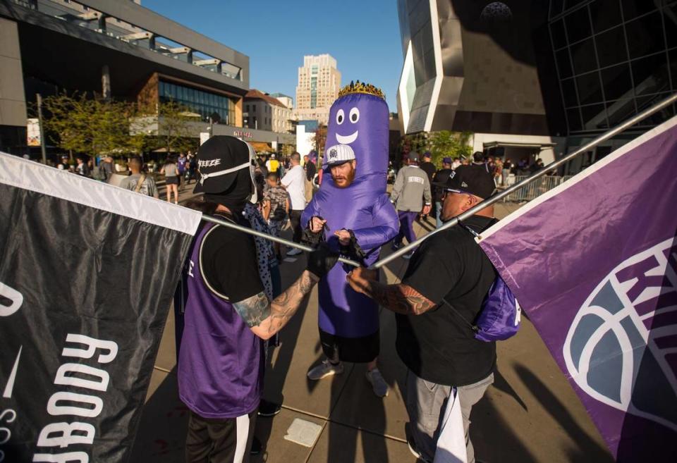 Robert Wood, dressed as “the beam” at center, came up from San Diego to celebrate with fellow Sacramento Kings fans during a rally outside Golden 1 Center on Friday to tip-off the 2023 playoffs. His childhood friend, Sacramento resident Taylor Cummings, said, “This is the renaissance for Sacramento, this the revival of this city — no longer is it just farm to fork, it’s now Fox to Sabonis.”