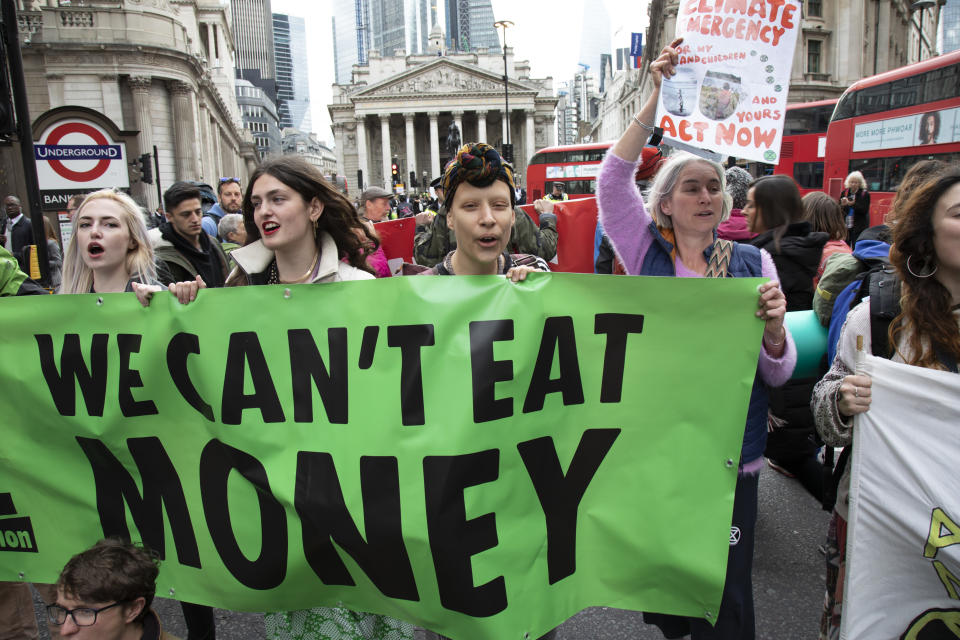 Climate change activist from the Extinction Rebellion group sings songs and block the streets outside the Bank of England in a swarming tactic in the heart of the City of London financial district in protest that the government is not doing enough to avoid catastrophic climate change and to demand the government take radical action to save the planet, on 25th April 2019 in London, England, United Kingdom. Extinction Rebellion is a climate change group started in 2018 and has gained a huge following of people committed to peaceful protests. (photo by Mike Kemp/In Pictures via Getty Images)