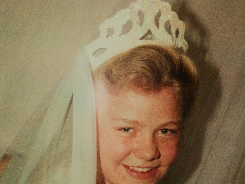 Former cult member Elissa Wall poses in a tiara and veil at her arranged marriage at the age of just 14. Her story is featured in the Netflix series "Keep Sweet: Pray and Obey."