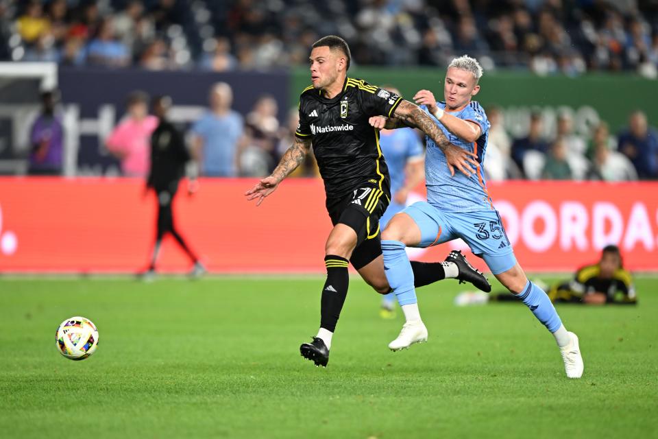 Jun 14, 2024; New York, New York, USA; Columbus Crew forward Christian Ramirez (17) battles New York City FC defender Mitja Ilenic (35) for the ball in the first half at Yankee Stadium. Mandatory Credit: Mark Smith-USA TODAY Sports