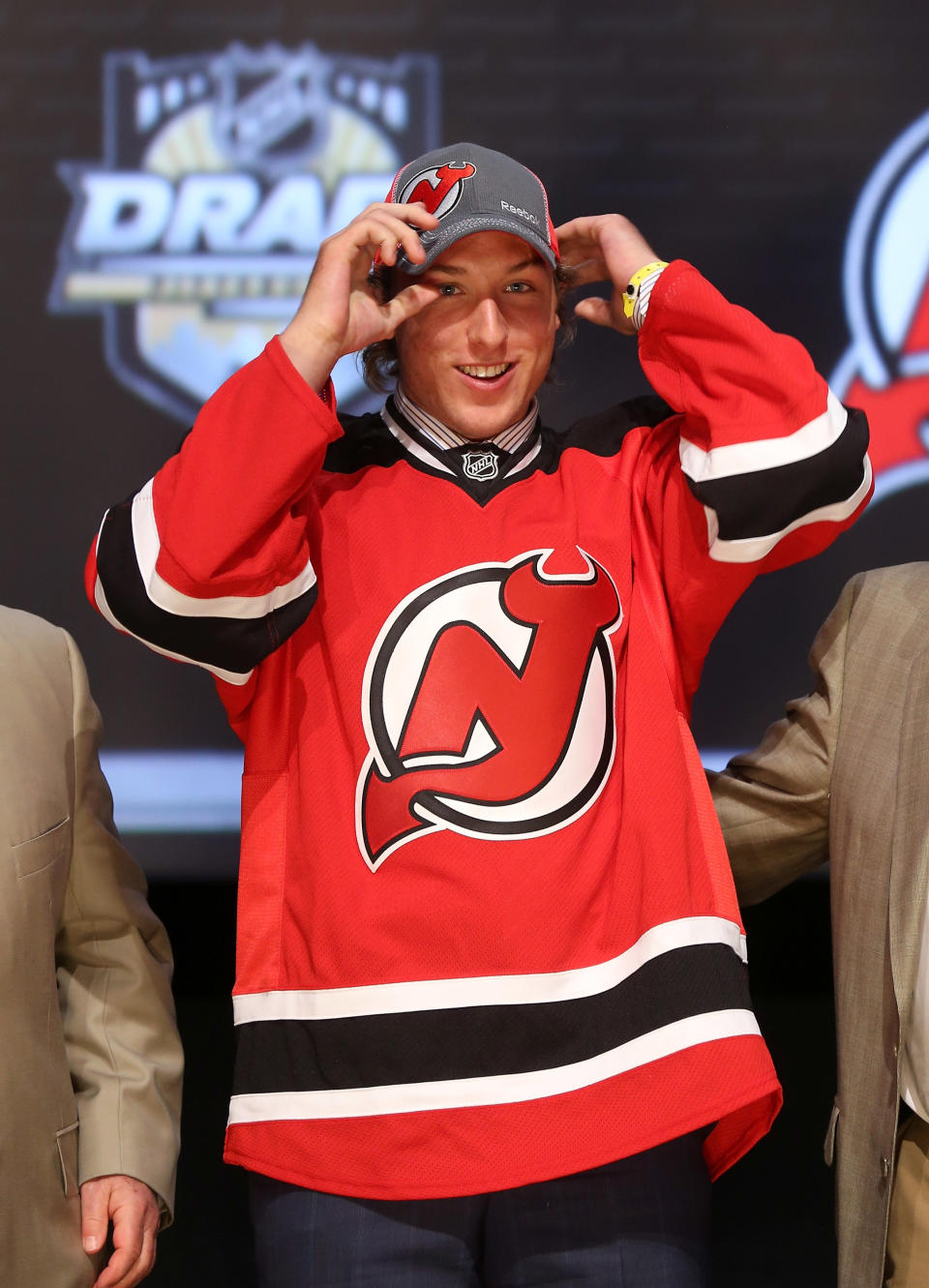 PITTSBURGH, PA - JUNE 22: Stefan Matteau, 29th overall pick by the New Jersey Devils, puts on a hat on stage during Round One of the 2012 NHL Entry Draft at Consol Energy Center on June 22, 2012 in Pittsburgh, Pennsylvania. (Photo by Bruce Bennett/Getty Images)