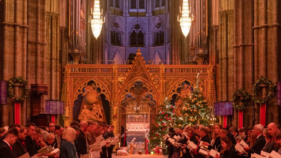 The interior of Westminster Abbey decorated with Christmas trees and wreaths