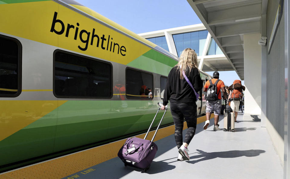 Passengers board a Brightline train to West Palm Beach, Fla., at the Fort Lauderdale station on Feb. 27, 2023. (Carline Jean / South Florida Sun Sentinel via Getty Images)