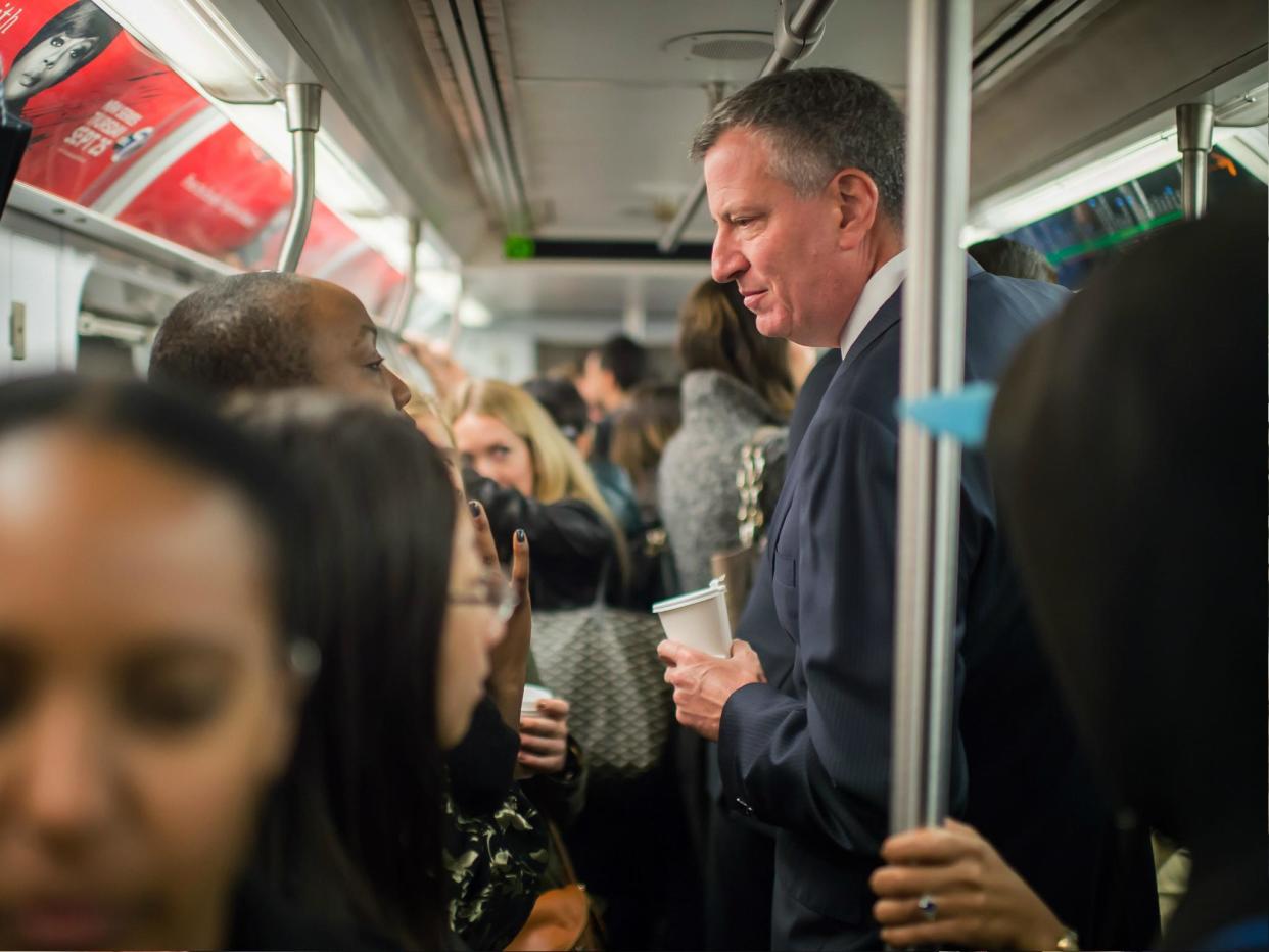 In this image handout provided by the Office of Mayor of New York, Mayor Bill de Blasio takes the subway on his route to City Hall, on 24 October 2014 in New York Cit: Rob Bennett/Office of Mayor of New York/Getty Images