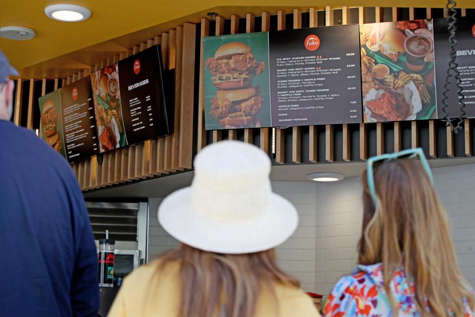 People wait in line for food from Fuku near Stadium 2 during the BNP Paribas Open at the Indian Wells Tennis Garden in Indian Wells, Calif., Wednesday, March 8, 2023.