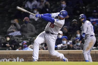 Los Angeles Dodgers Max Muncy hits a home run off Chicago Cubs relief pitcher Craig Kimbrel during the seventh inning of a baseball game Tuesday, May 4, 2021, in Chicago. (AP Photo/Charles Rex Arbogast)