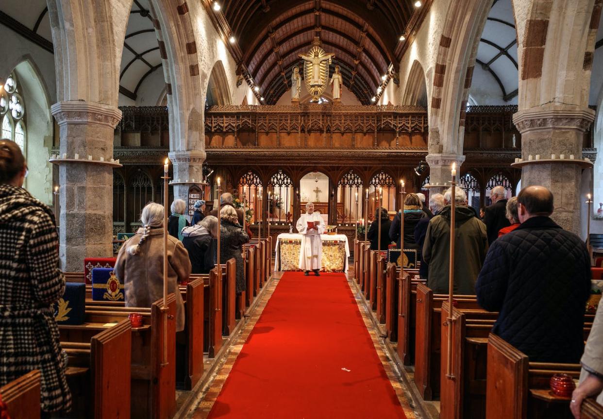 A service in the village church of St. Paul de Leon in Devon, England. <a href="https://www.gettyimages.com/detail/news-photo/members-of-the-congregation-stand-before-taking-holy-news-photo/1452321203?phrase=church%20of%20england&adppopup=true" rel="nofollow noopener" target="_blank" data-ylk="slk:Hugh R Hastings/Getty Images;elm:context_link;itc:0;sec:content-canvas" class="link ">Hugh R Hastings/Getty Images</a>