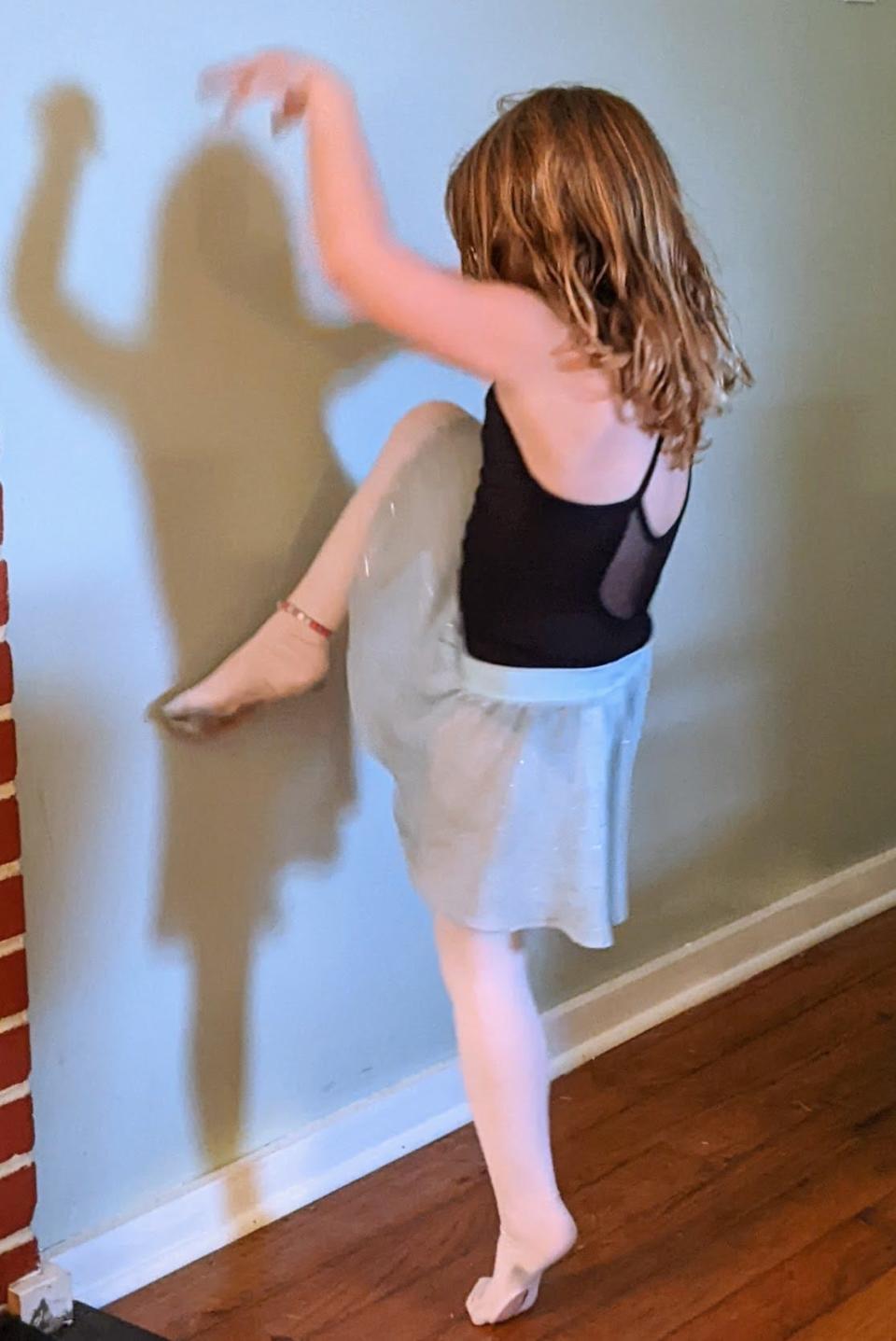 John Job's 5-year-old daughter Patti June dances.