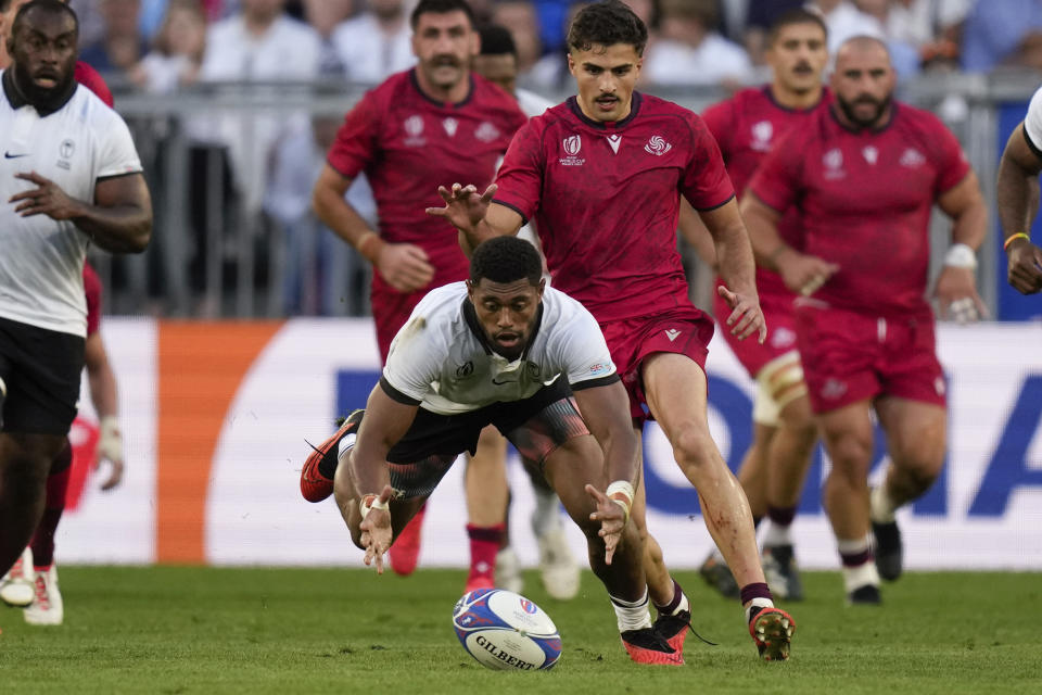 Fiji's Ilaisa Droasese, jumps to catch the ball during the Rugby World Cup Pool C match between Fiji and Georgia at the Stade de Bordeaux in Bordeaux, France, Saturday, Sept. 30, 2023. (AP Photo/Thibault Camus)