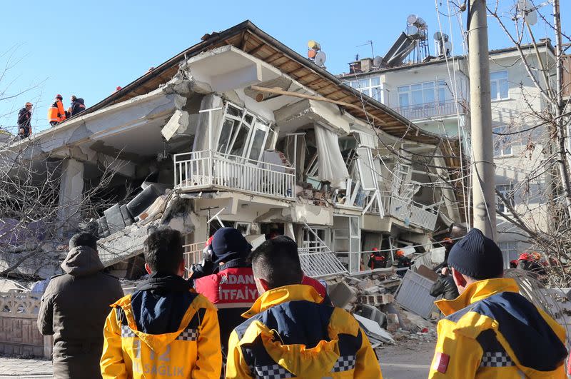 Rescuers work on a damaged building after an earthquake in Elazig