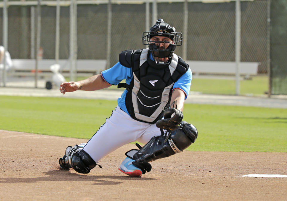 FILE - In this Feb. 12, 2020, file photo, Miami Marlins catcher Francisco Cervelli run drills during a spring training baseball workouts for pitchers and catchers at Roger Dean Stadium in Jupiter, Fla. Cervelli says he’s fully recovered from his latest concussion, and Jorge Alfaro says he’s feeling fitter after an offseason spent working on the farm and running sprints. At catcher, at least, the Miami Marlins appear in good shape. (David Santiago/Miami Herald via AP, File)