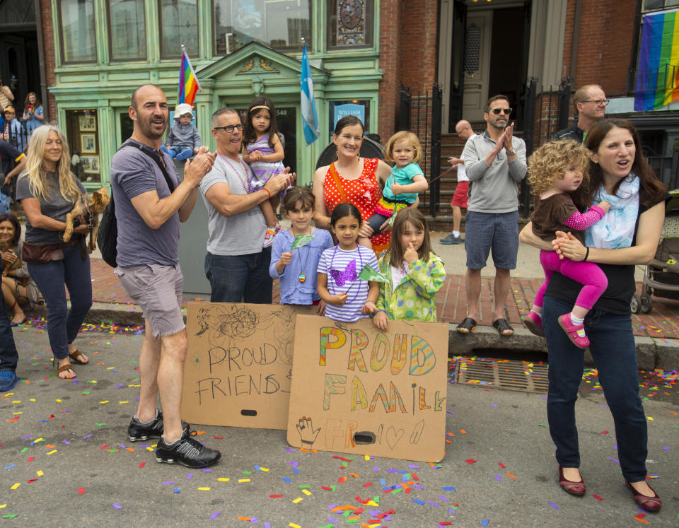 Families cheering on the Boston Pride parade in the South End of Boston, Massachusetts, on June 14, 2014. (Photo by Rick Friedman/Corbis via Getty Images)