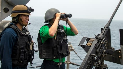 US sailors aboard an amphibious assault ship survey the Strait of Hormuz on August 12, 2019