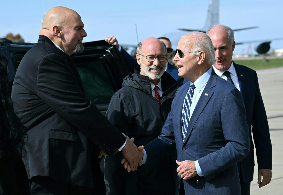 President Biden is greeted by Pennsylvania Lt. Gov. and Democratic senatorial candidate John Fetterman upon arrival at Pittsburgh International Airport on Oct. 20.